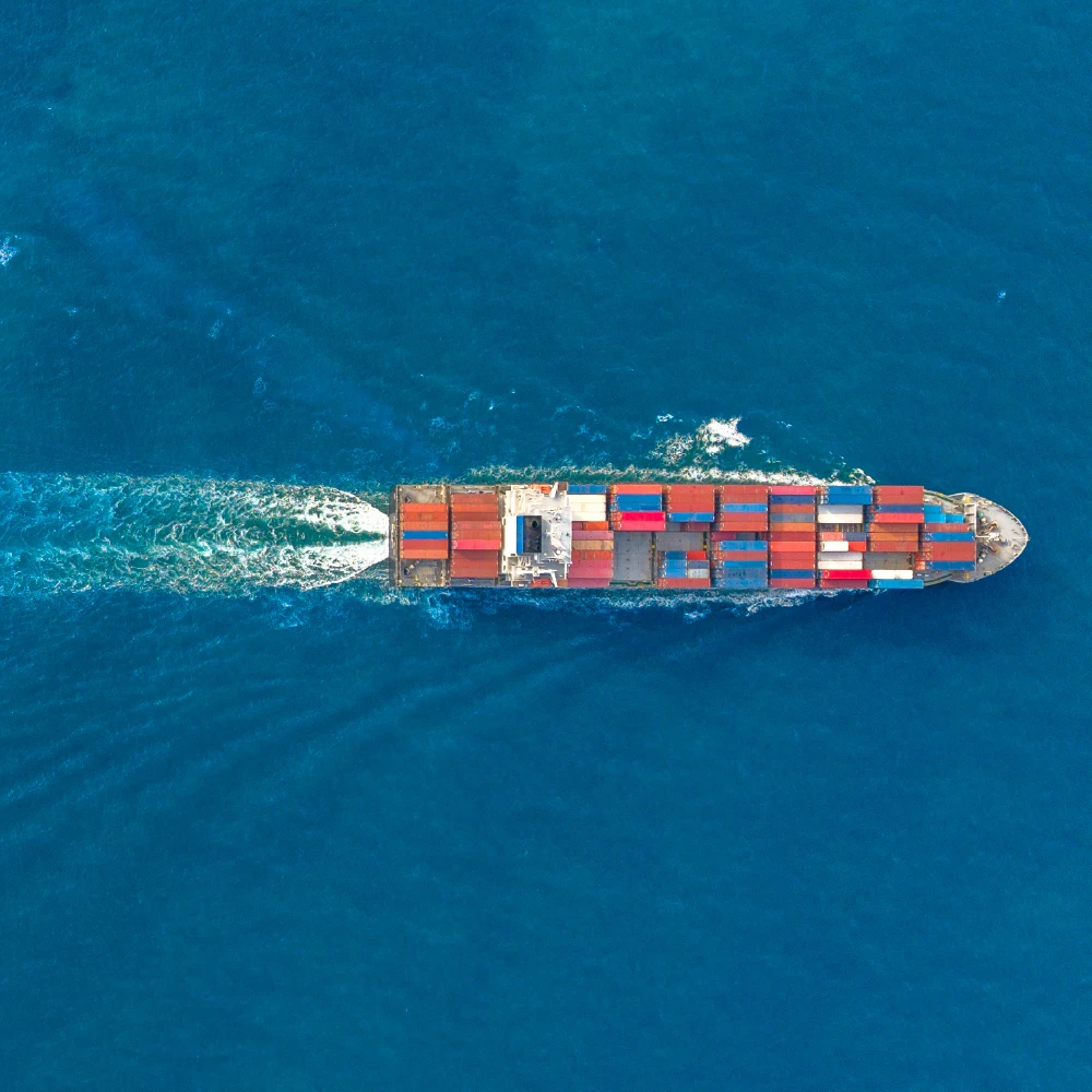A container ship moving across a body of water.